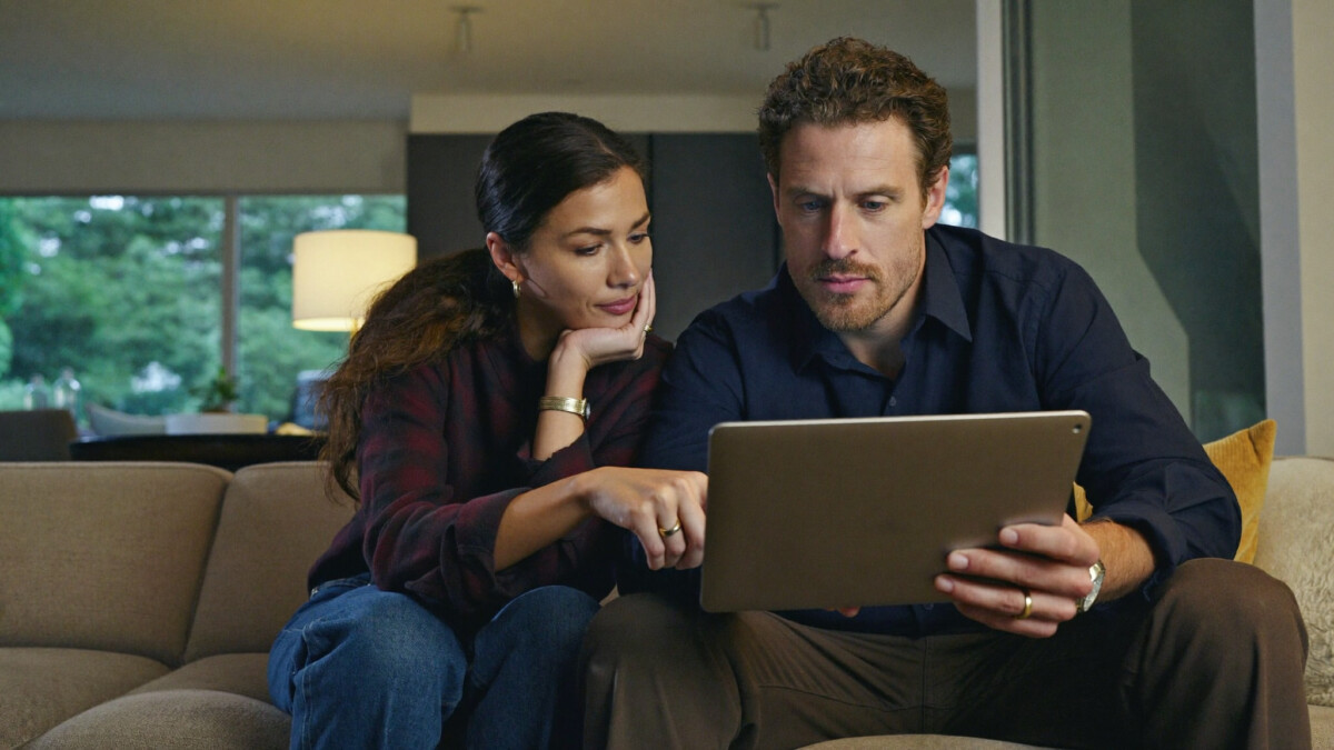 a couple reviewing their retirement and investment accounts together