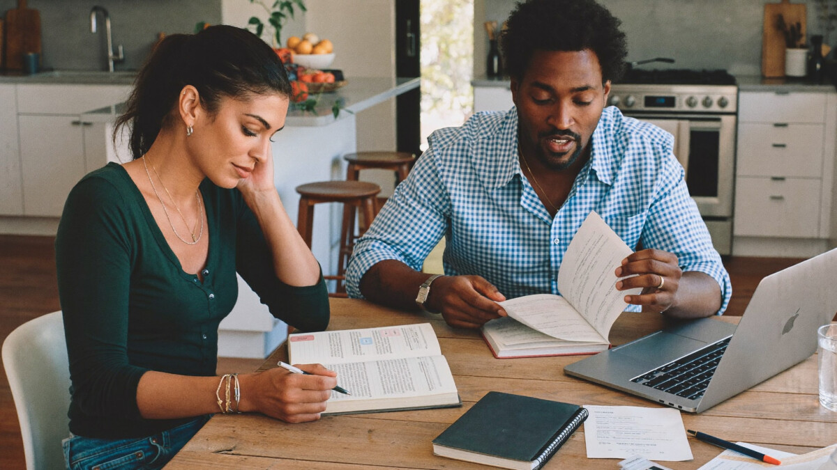 couple reviewing budget and finances together at home