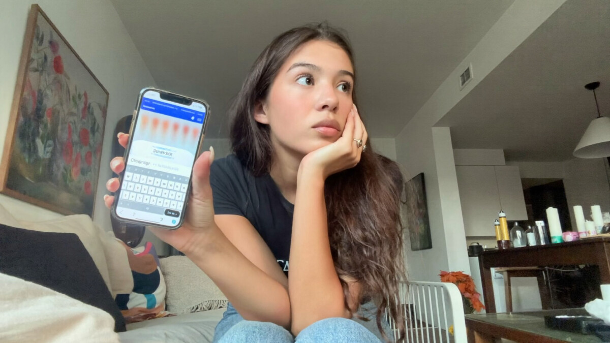 24-hour rule for purchases - woman pausing before buying on smartphone